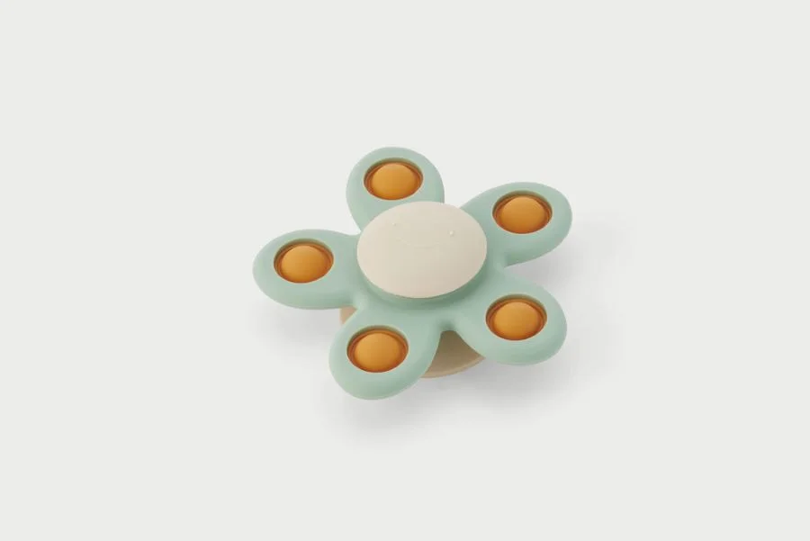 Spinner divertit i acolorit amb cinc pètals, cadascun amb botons emergents que ofereixen una experiència sensorial interactiva, captant l’atenció ...