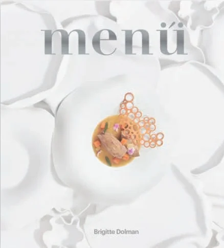 Menu is a tribute to cuisine as both art and memory. It brings together complete menus —starters, main courses, and desserts— that reinterpret cla...