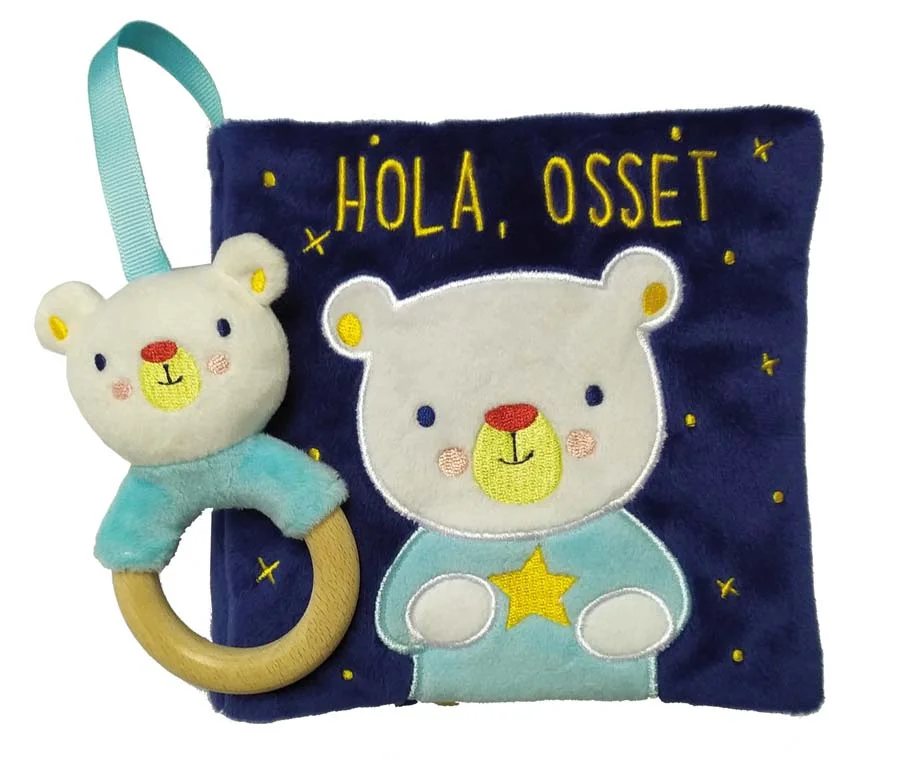 Què fa l'osset avui? Un llibre de roba amb cobertes de vellut i un sonall per compartir durant les rutines diàries dels infants. Una companyia ide...
