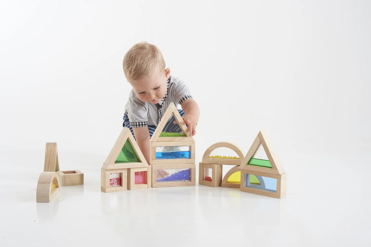 Blocs sensorials de fusta transparents 16 unitats